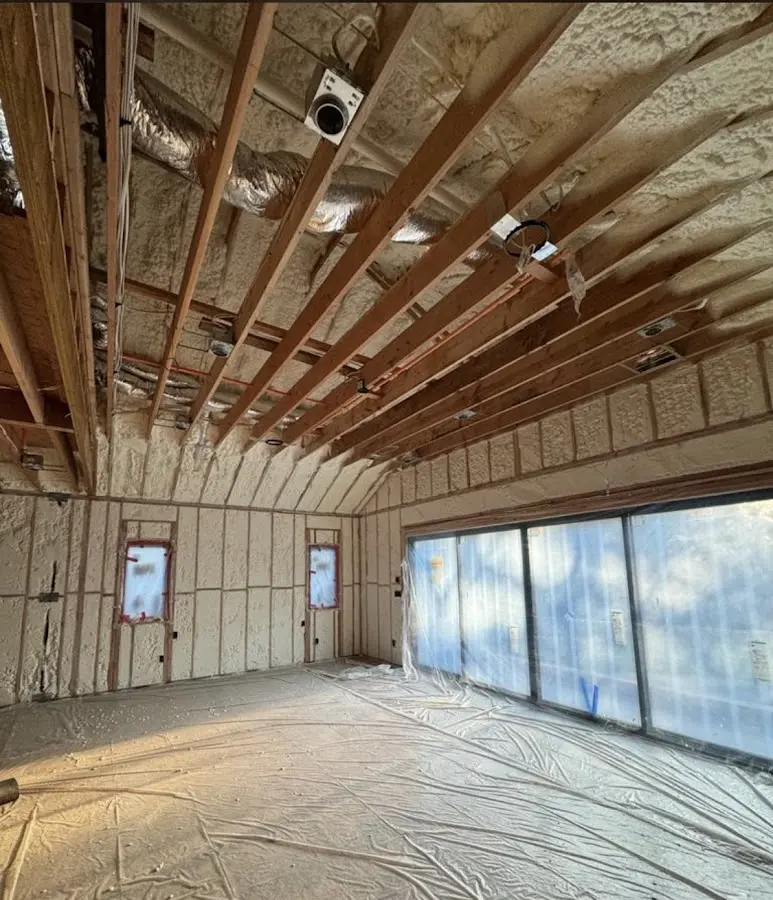 Interior walls and ceiling insulated with spray foam during new construction in South Boston